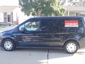 van with local locksmith sticker